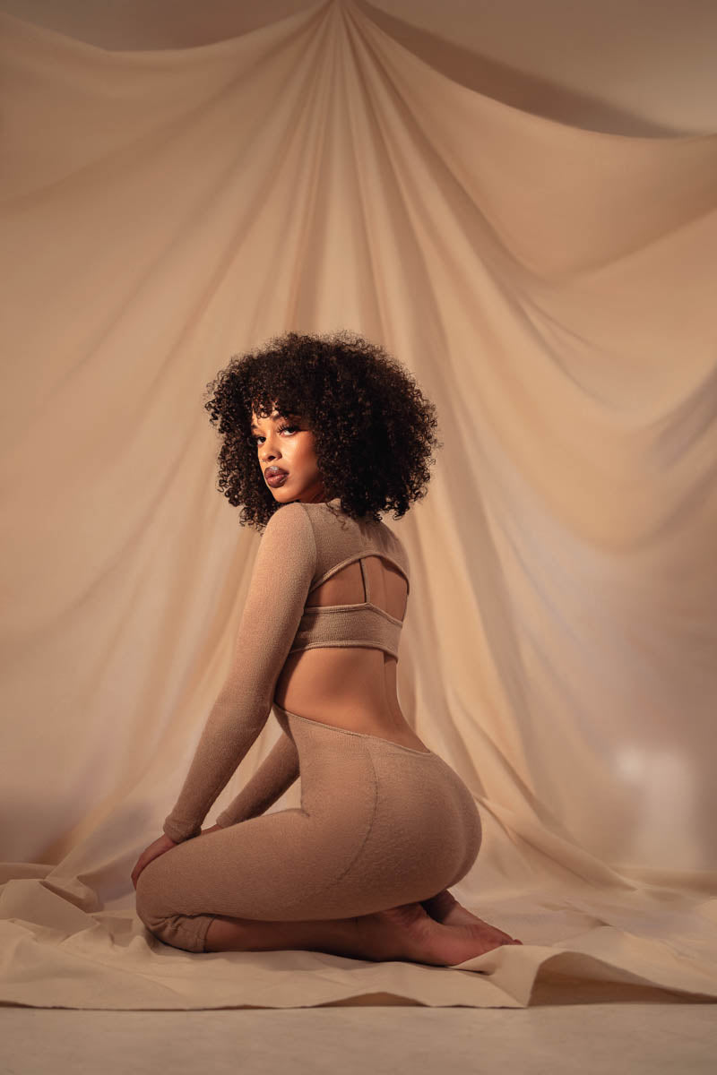 Sultry. Potent. Buoyant.  Our Naked Knit dress & brassiere is the most body complimentary duo you’ll ever come to know, as is every other garment in our entire collection. Hip hugging, long sleeve, open back goodness. You’ll want to wear this everyday, every night & everywhere.  Materials & Care  95% Poly-Cotton blend, 5% Spandex Care: Hand wash Imported Size & Fit  Model measures: 34B bust, 28” waist, 38.5” hips, 5’8 in height & is wearing a size XS/S This dress is reversible. Size up for a looser fit.